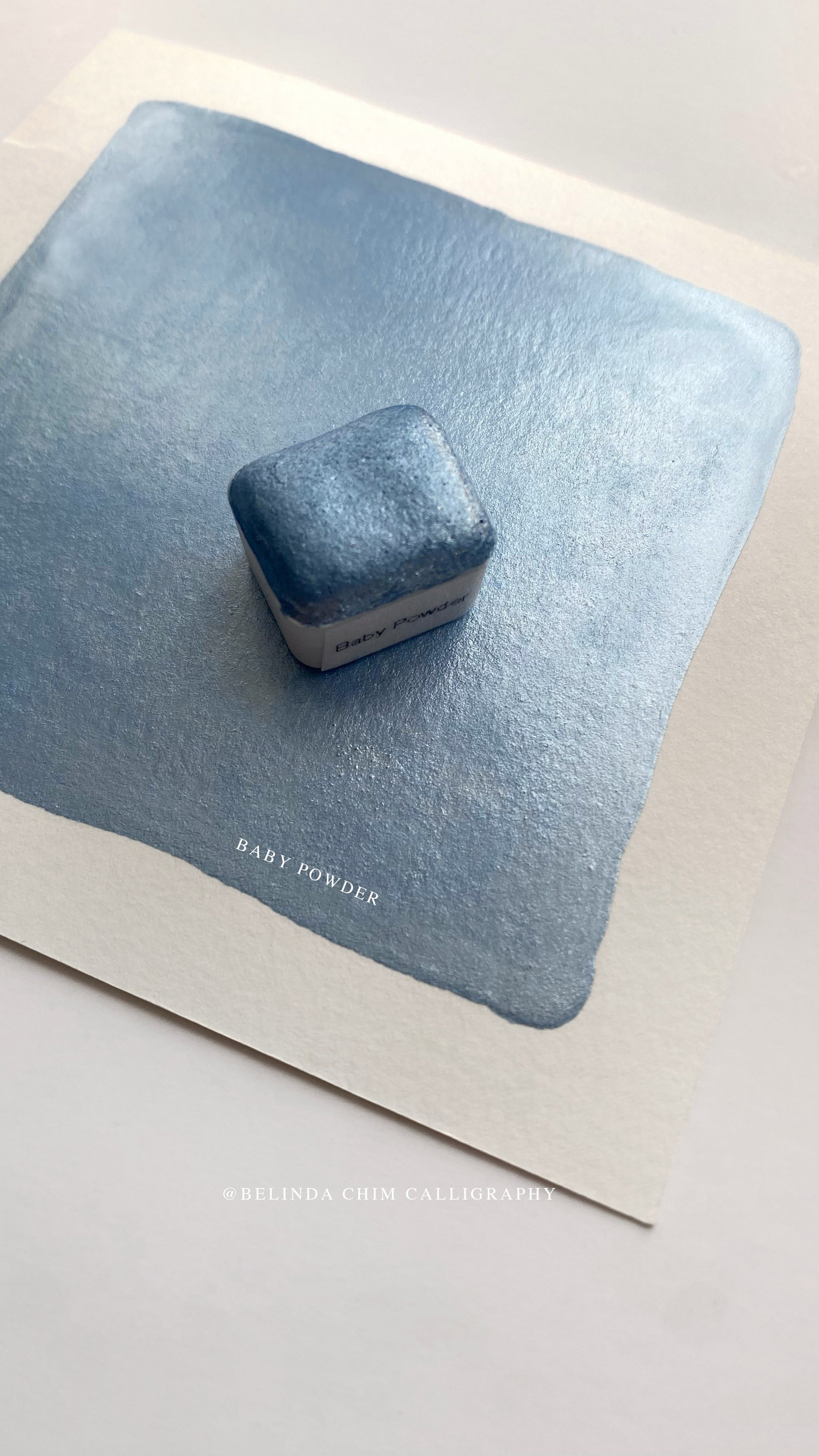 Homemade metallic watercolor in blue