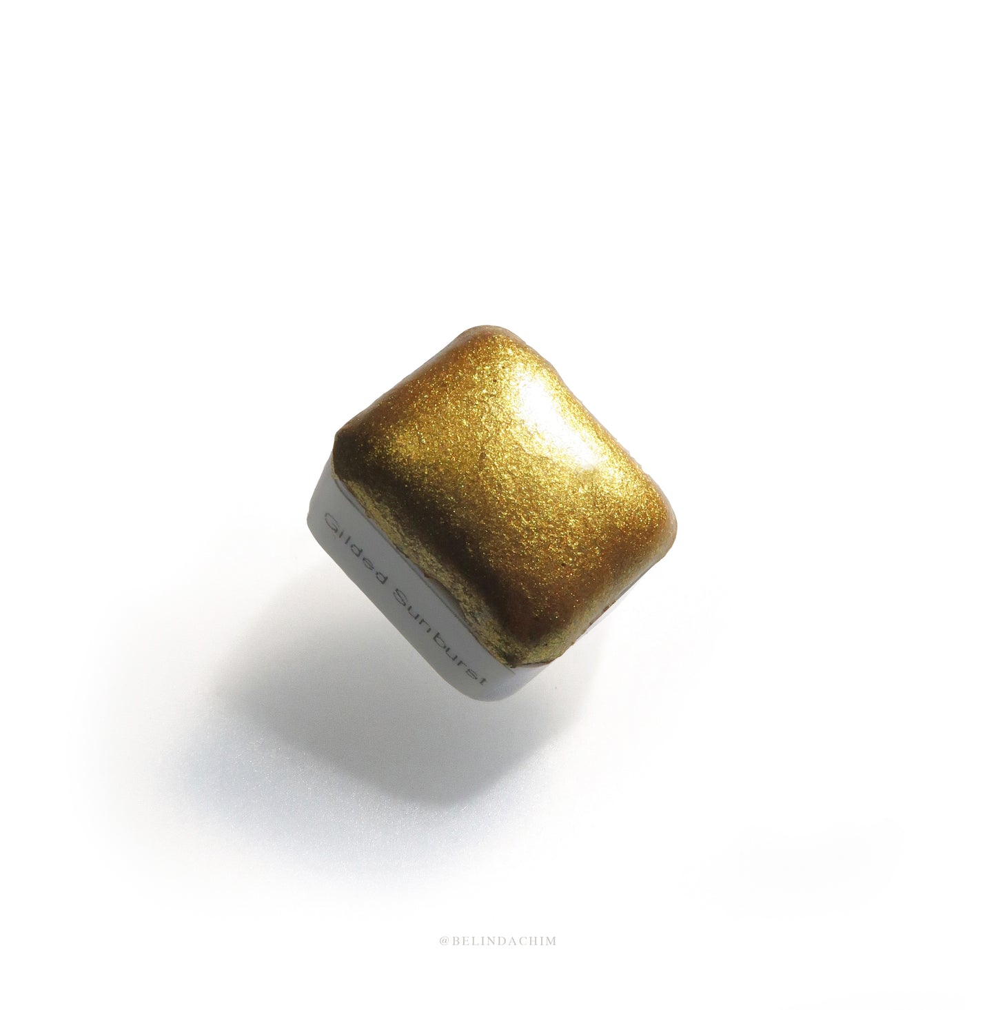 Homemade metallic watercolor in gold