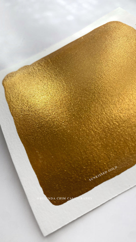 Homemade metallic watercolor in gold