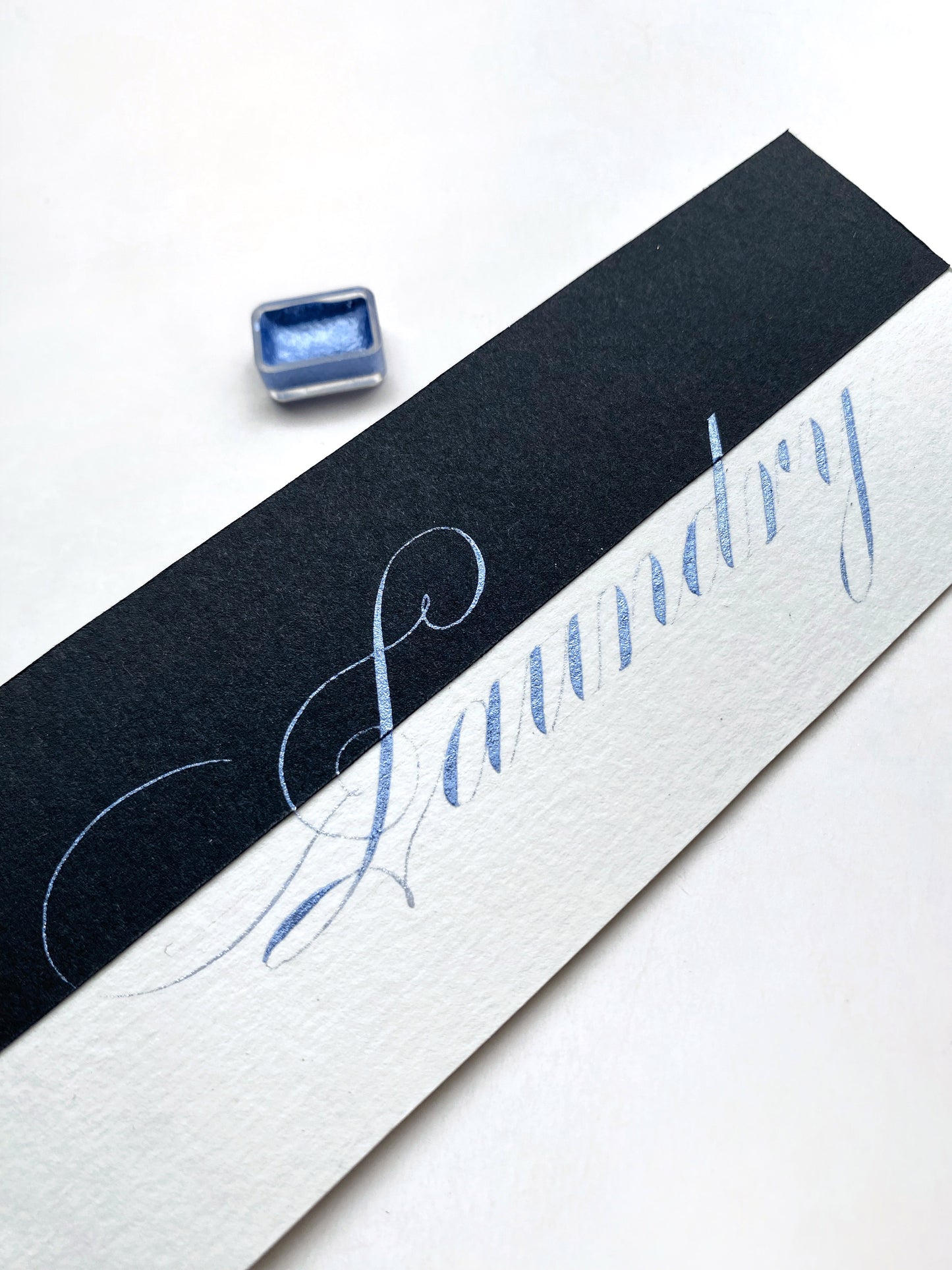 Homemade metallic watercolor in blue